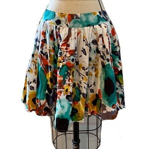 WET SEAL Floral printed, pleated, flared, knee-length skirt.